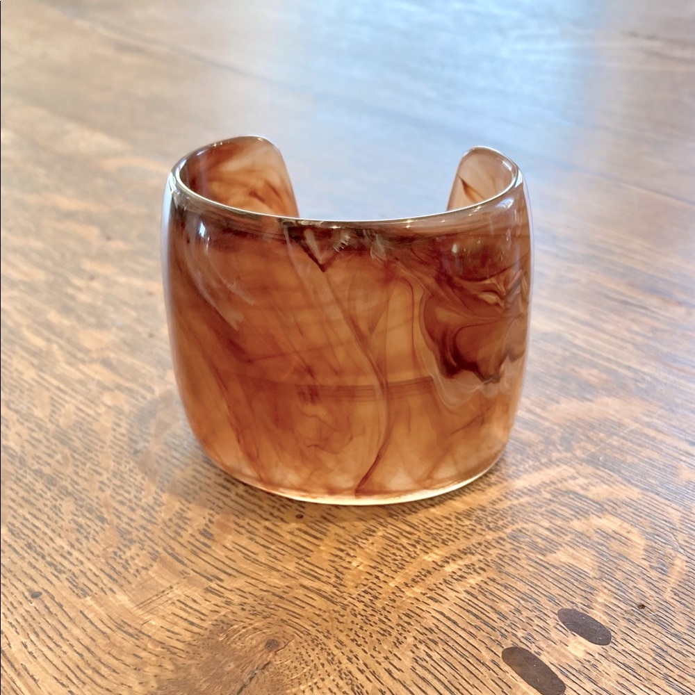 A wide cuff bracelet.
